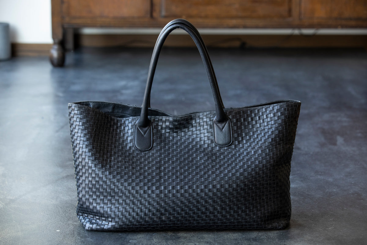 A large tote bag with a striking leather sheen